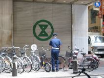 Security Guard Carefully Arranging Bicycles, Osaka